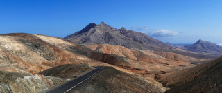 Mountain road landscape cloudy sky - a mountainous area free wallpaper