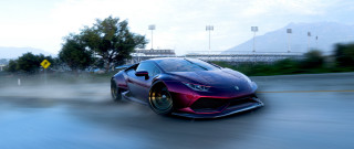 Red sports car street field - a stadium in the background free wallpaper