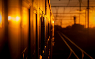 Train sunset backlighting blurry orange - a train free wallpaper for desktop