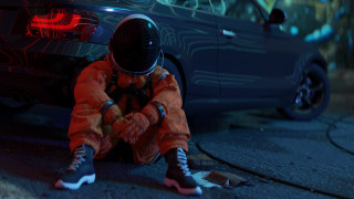 Space suit person sitting car - the ground next free wallpaper