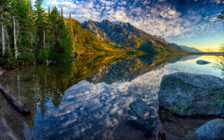 Mountain lake reflections forest sky - a mountain lake free wallpaper