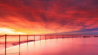 Sunset beach fence water red - vibrant colour free wallpaper