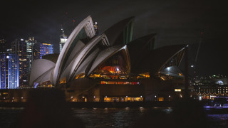 Large building city lights night 2 - a city in the background free wallpaper