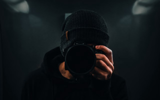 Man holding camera dark room - new free wallpaper for desktop