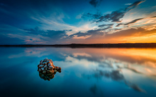 Rock lake sunset clouds portrait - a body of water below free wallpaper
