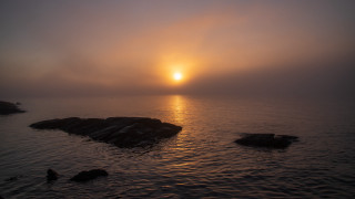Sunset ocean island rocks clouds - a small island in the middle of the water free wallpaper