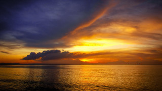Sunset ocean clouds boat horizon 3 - a boat in the distance free wallpaper