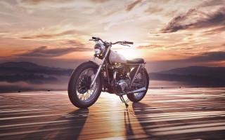 Motorcycle wooden floor sunset mountains - the background and a mountain range in the distance free wallpaper