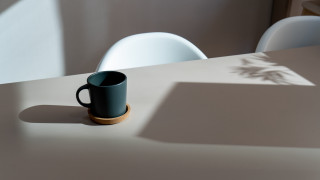 Black coffee cup white chair - a white tablecloth free wallpaper