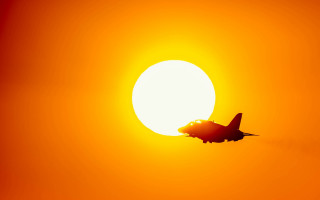 Jet sunset orange moon cloud - a plane in the foreground free wallpaper