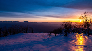 Sunset snowy mountain trees people - a sunset over a snowy mountain free wallpaper
