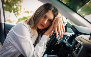 Woman car blurry depthoffield longhair - promotional free wallpaper