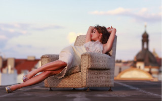 Woman sitting beach city bokeh - constanceanne parker free wallpaper for desktop