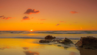 Sunset ocean rocks orange sky 2 - orange sky in the background free wallpaper