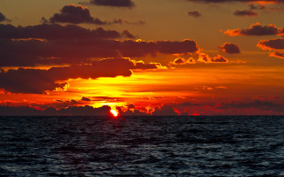 Sunset ocean clouds boat horizon 2 - the water below free wallpaper