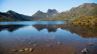 Lake mountains rocks water sky - a few rock free wallpaper