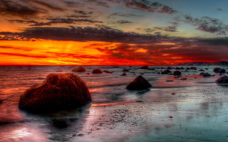 Sunset beach rocks clouds mountain 2 - a few rock free wallpaper