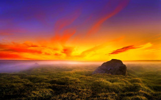 Sunset grassy field rock red 2 - sky in the background free wallpaper for desktop