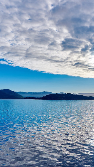 Boat water cloudy sky mountains 3 - free mountains wallpaper for mobile
