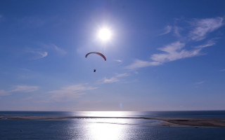 Parasailer ocean blue sky sunbeam - a sunbeam in the background free wallpaper