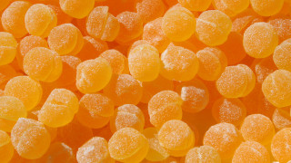 Orange candies sugar white background - sugar free wallpaper