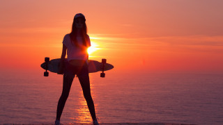 Woman surfboard pier sunset ocean - the ocean in the background free wallpaper