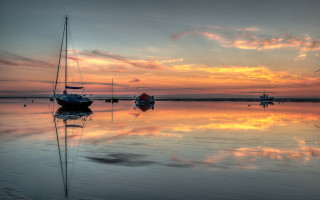 Boats sunset reflections cloudy sky - a couple of boats free wallpaper