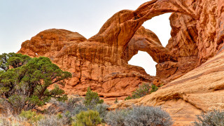 Large rock arch forest puzzle - a large rock formation free wallpaper for desktop