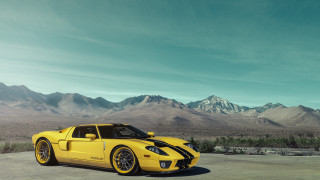 Yellow sports car mountain scape - a yellow sports car free wallpaper