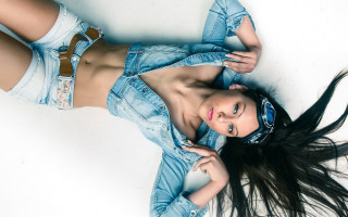 Woman jean jacket shorts laying - fashion photography free wallpaper