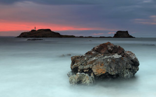 Rock lighthouse sunset pink sky - a lighthouse in the background free wallpaper