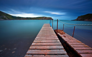 Wooden dock night mountains cloudy - a wooden dock free wallpaper
