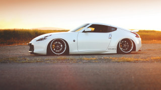 White sports car sunset gravel - a gravel road free wallpaper
