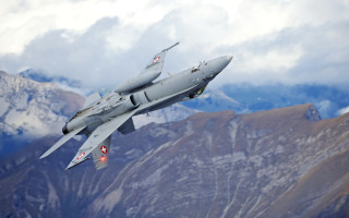 Fighter jet mountain cloud sky - over a mountain range in the sky free wallpaper