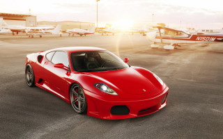Red sports car parking lot - the tarmac free wallpaper