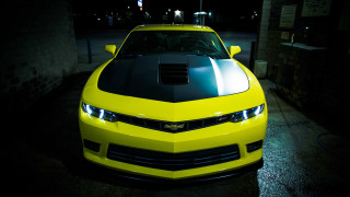 Yellow car hood up night - a dark garage free wallpaper
