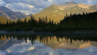 Lake mountains trees cloudy sky 46 - tree and mountains under a cloudy sky free wallpaper