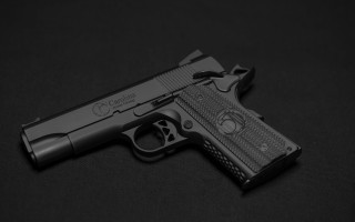 Gun laser engraved black background - realistic free wallpaper for desktop