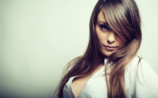 Woman longhair white shirt portrait 5 - a white background behind her free wallpaper