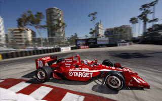 Red race car cityscape tiltshift - a red race car free wallpaper