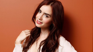 Celia fiennes red wall pose - a red background behind her free wallpaper