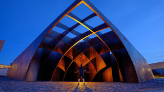 Person metalstructure blueSky trianglebuilding scenery - triangular free wallpaper