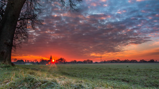 Sunset field tree church red - a sunset over a field free wallpaper