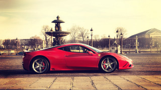 Red sports car city fountain - a fountain in the background free wallpaper
