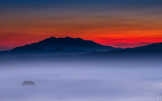 Mountain foggy sunset red sky - a red sky in the background free wallpaper