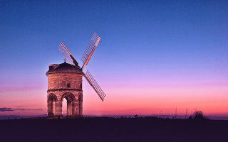 Windmill hill purple sky sunset - a purple sky in the background free wallpaper for desktop