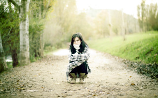 Woman plaid coat woods outstretched - a scarf free wallpaper