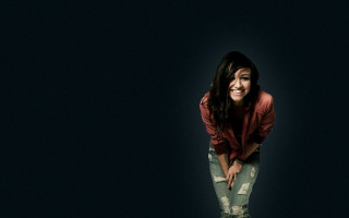 Woman smiling dark background jacket - dark background free wallpaper