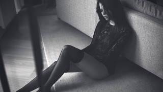 Woman sitting crossed legs black 2 - moody free wallpaper