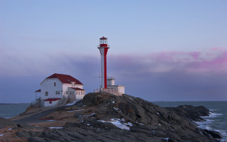 Lighthouse rocky shore red roof - a red roof free wallpaper